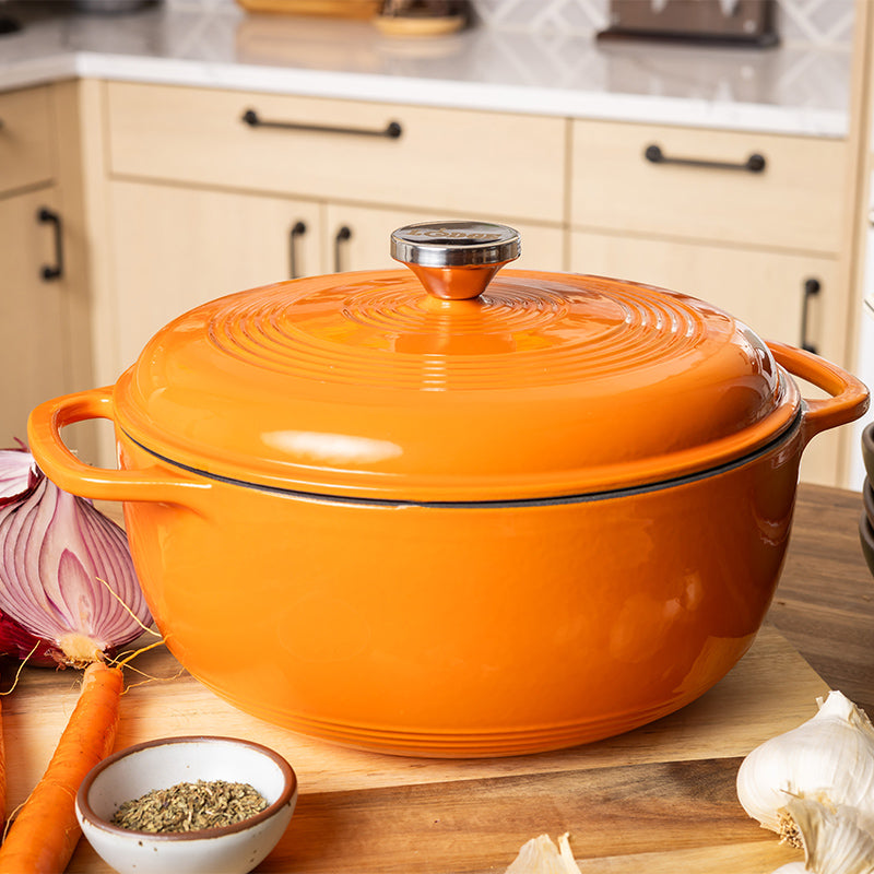 Dutch oven on kitchen counter near prepped ingredients.
