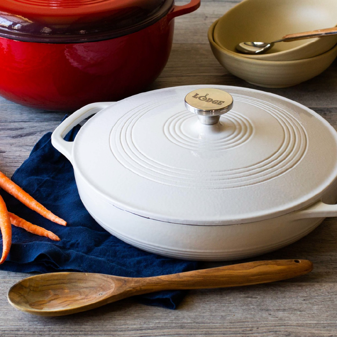 Braiser on kitchen table with other cooking utensils.