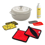 Set of cookware items including an oyster colored Dutch oven, pot holders, enamel cleaner, everyday scrub cloths, and pan scrapers.