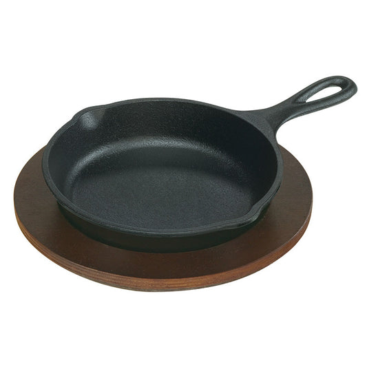 Skillet on wooden underliner.