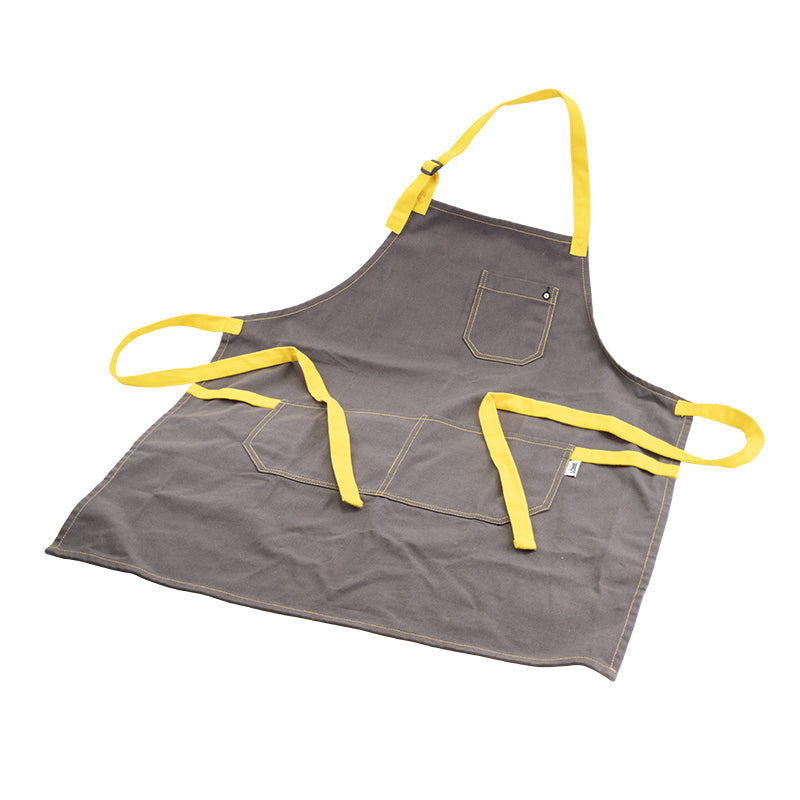 Apron laid out, displaying 3 pockets, neck strap, and back ties.