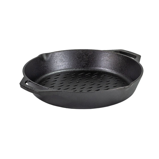 Black cast iron skillet with holes on bottom, along with 2 handles and pour spouts.