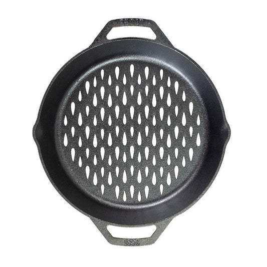 Top view of pan showing teardrop shaped holes so flame can reach food without losing anything between the grates.
