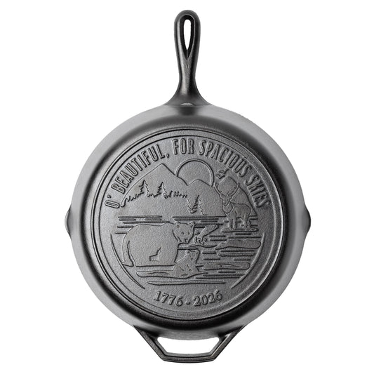 Cast iron skillet with back engraved featuring lyrics and imagery from America The Beautiful.