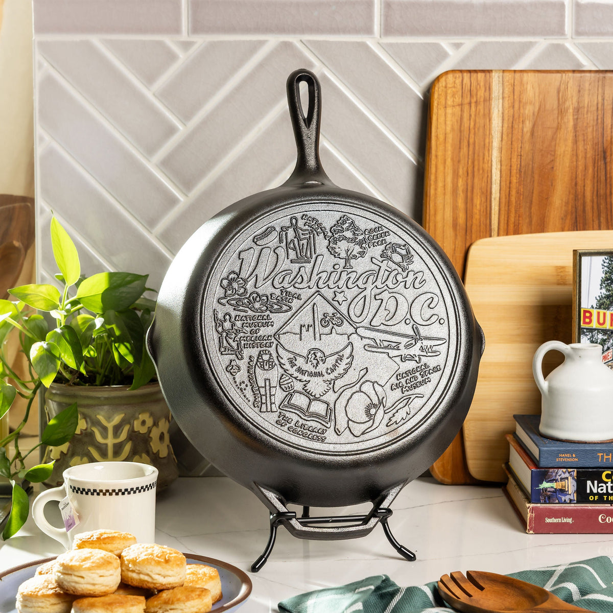 Decorative cast iron skillet with Washington DC design on a kitchen counter.