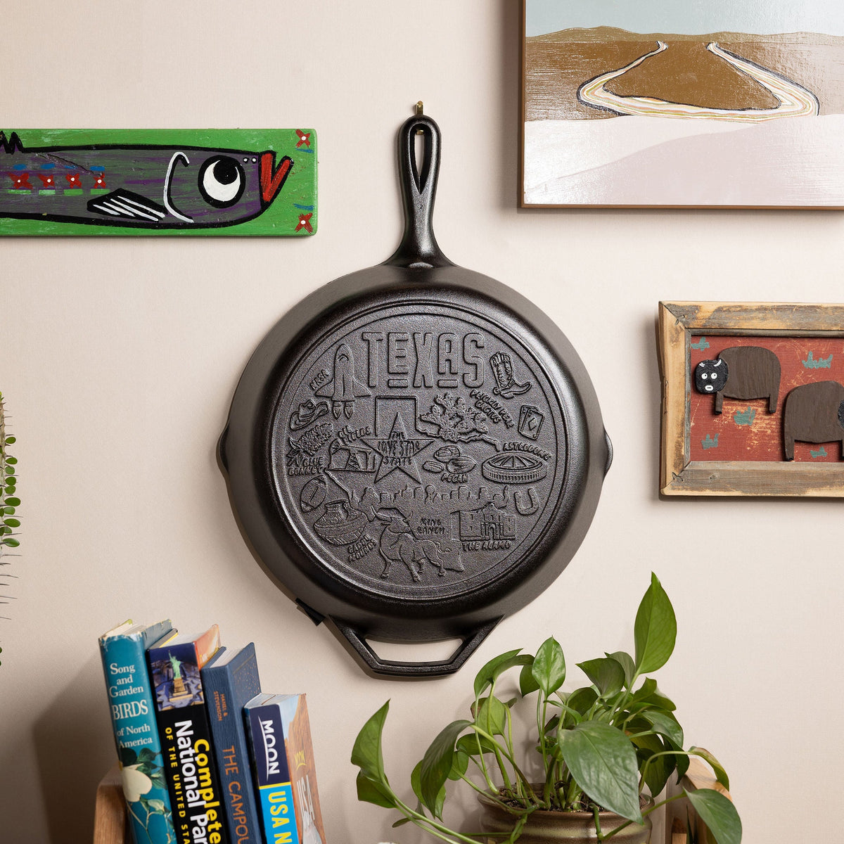Texas state skillet displayed on a wall.