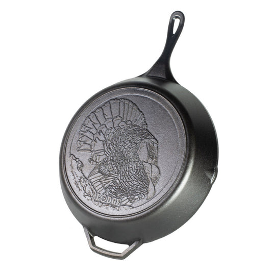 Black skillet with an embossed turkey on the back of it.