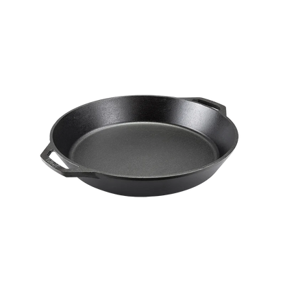Black cast iron skillet with two loop handles.