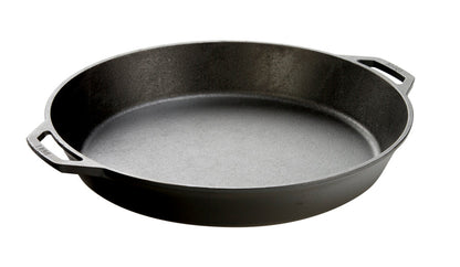 Black cast iron skillet with two loop handles.