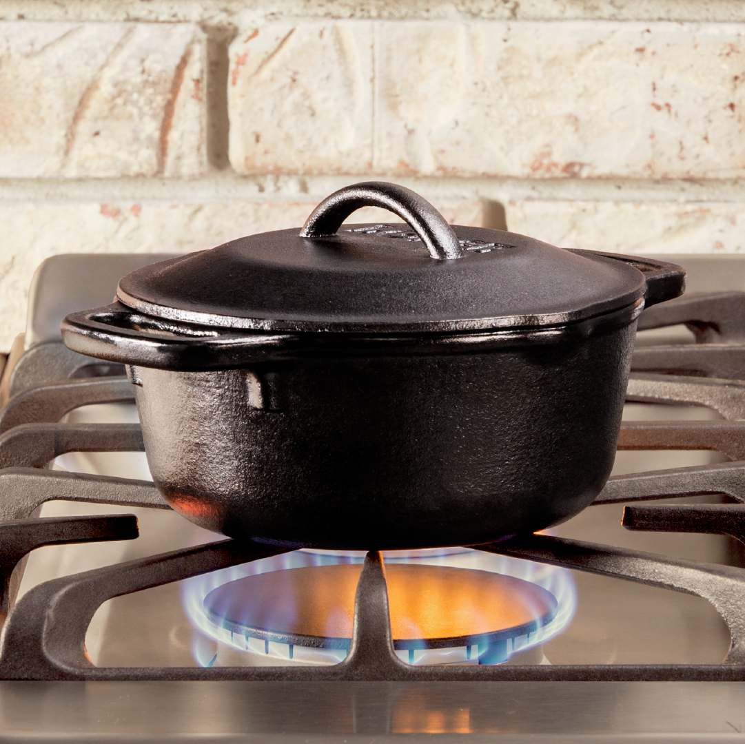 Dutch oven being used to cook on stovetop.
