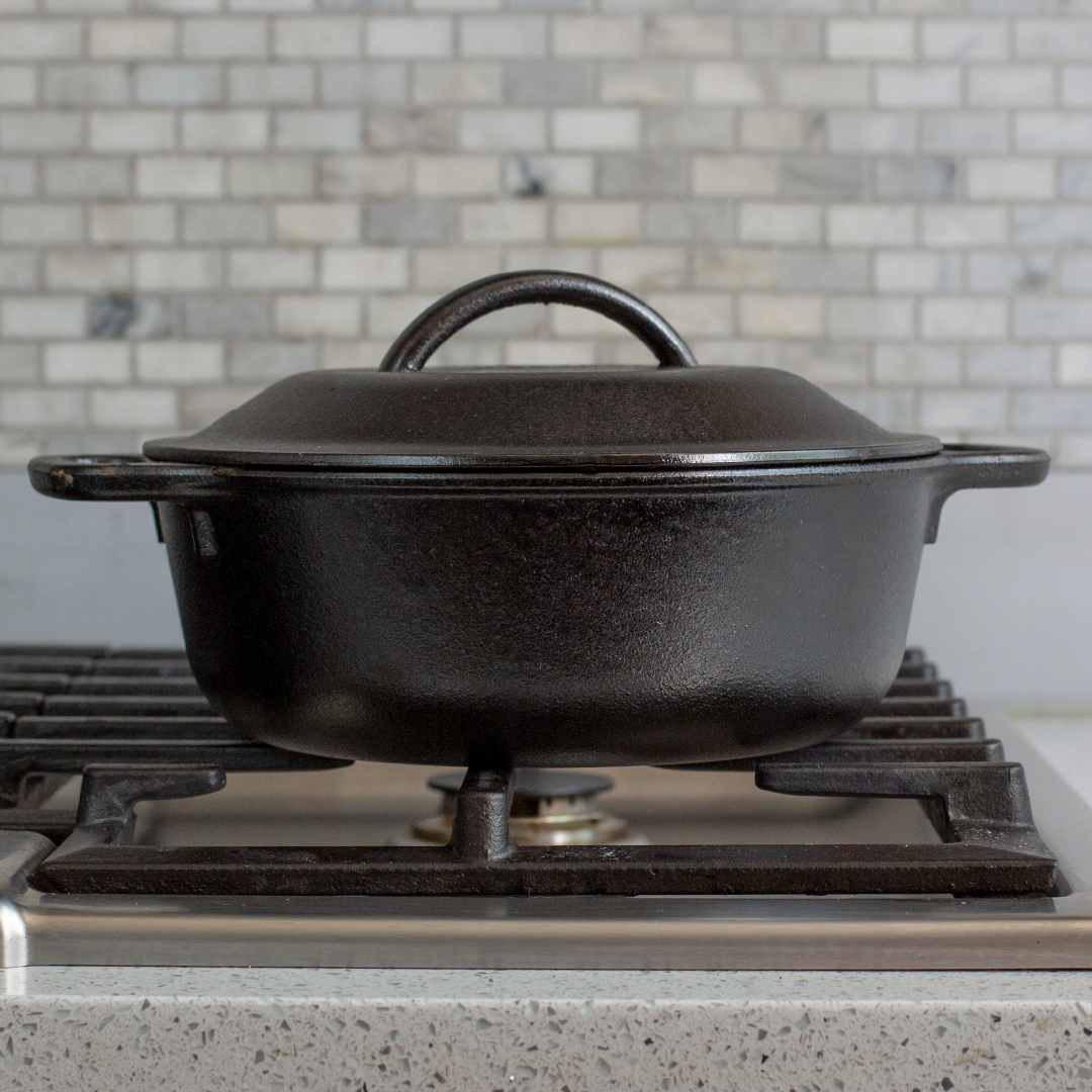 Dutch oven being used to cook on stovetop.