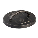 Round black press with a handle and Lodge branding.