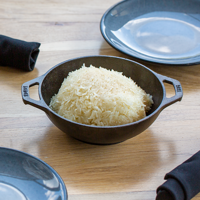 White rice served in wok on table