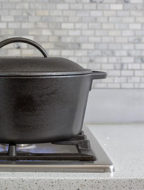 Dutch oven being used to cook on stovetop.