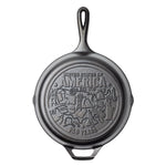Cast iron skillet with engraved design on back featuring monuments and icons from around the country.
