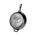 Cast iron skillet with embossed design featuring a deer with antlers in a forest.