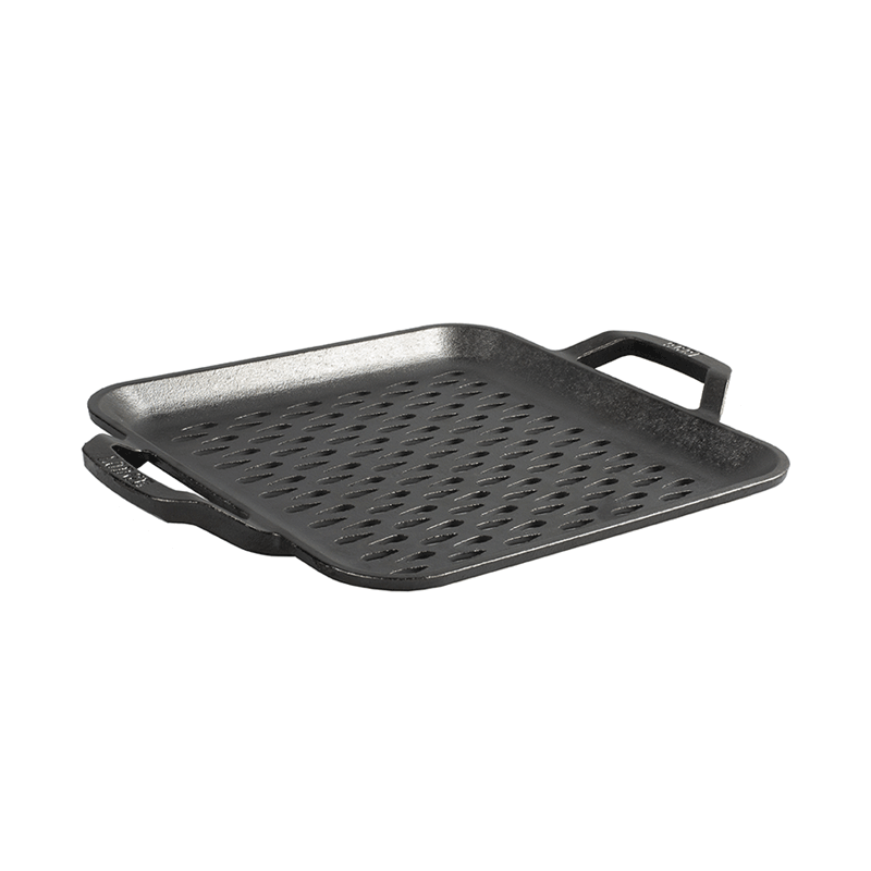Black cast iron grill pan with perforations and handles on a white background