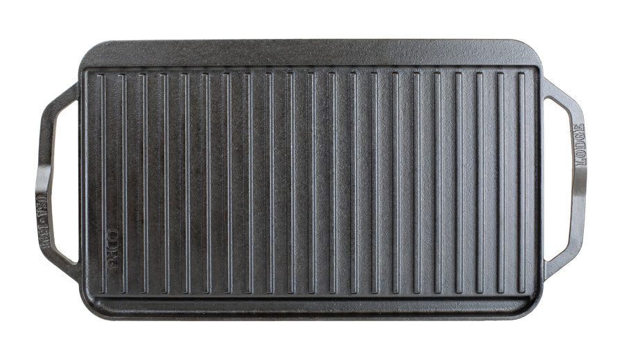 Top view featuring the grill pan side showing slot for grease to fall and a constructed handle shape for easy use on each side.