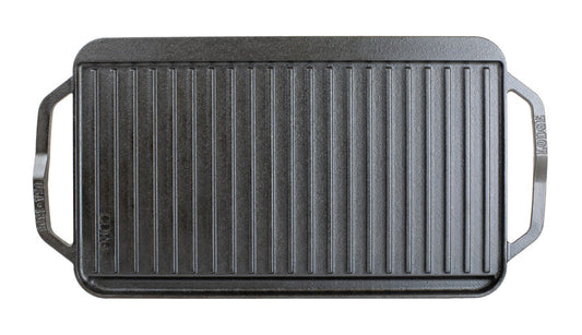 Top view featuring the grill pan side showing slot for grease to fall and a constructed handle shape for easy use on each side.