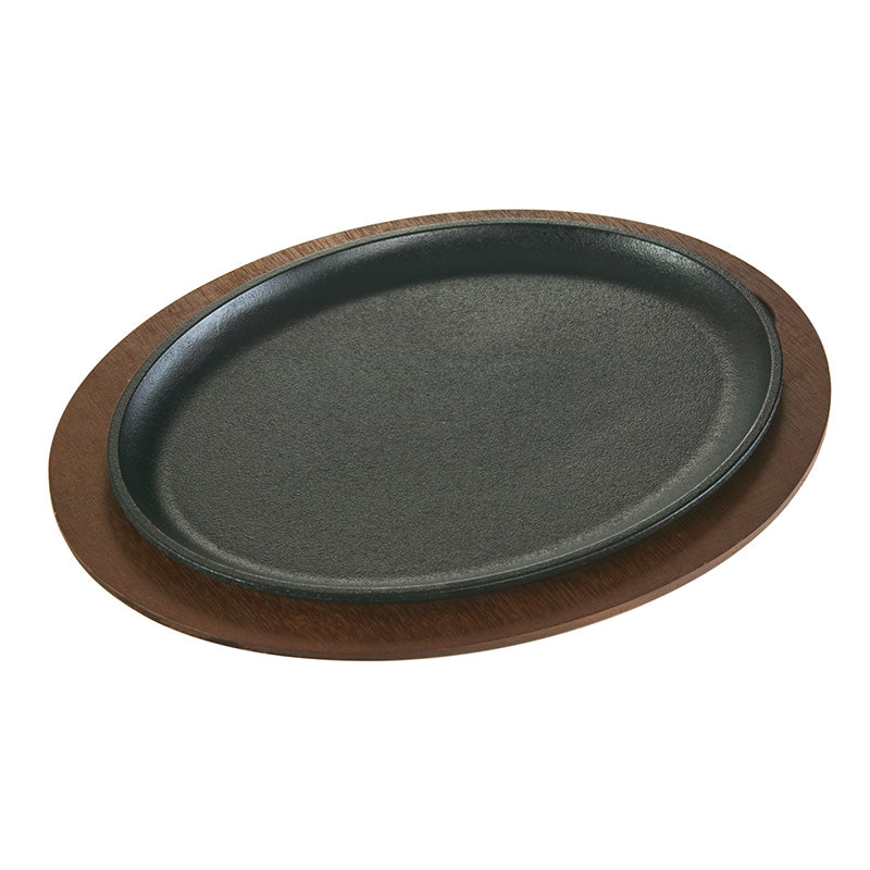 Serving griddle on dark wood underliner.