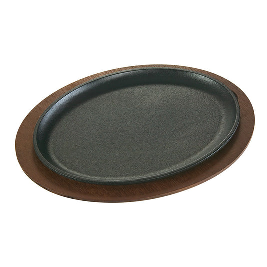 Serving griddle on dark wood underliner.