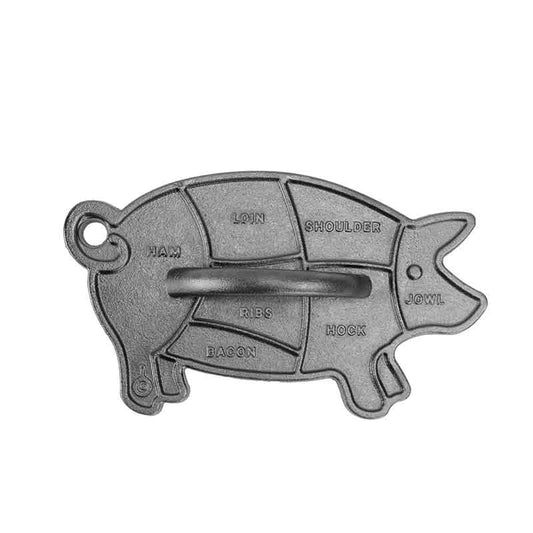 Grill press in shape of pig with detailed diagram of meat cuts and handle.