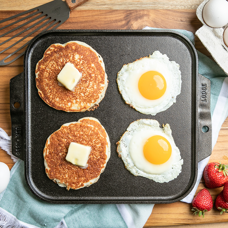 Pancakes and eggs, prepared and served with griddle.