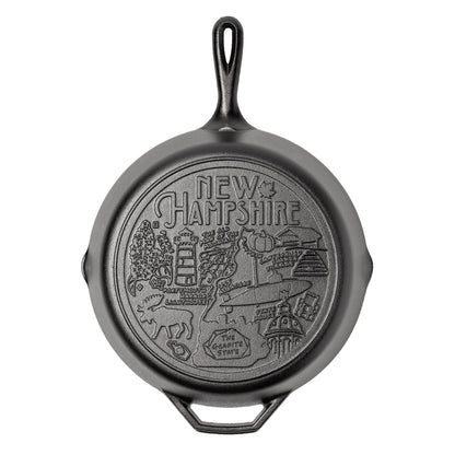 Cast iron skillet with the bottom engraved with beloved icons and monuments from New Hampshire.