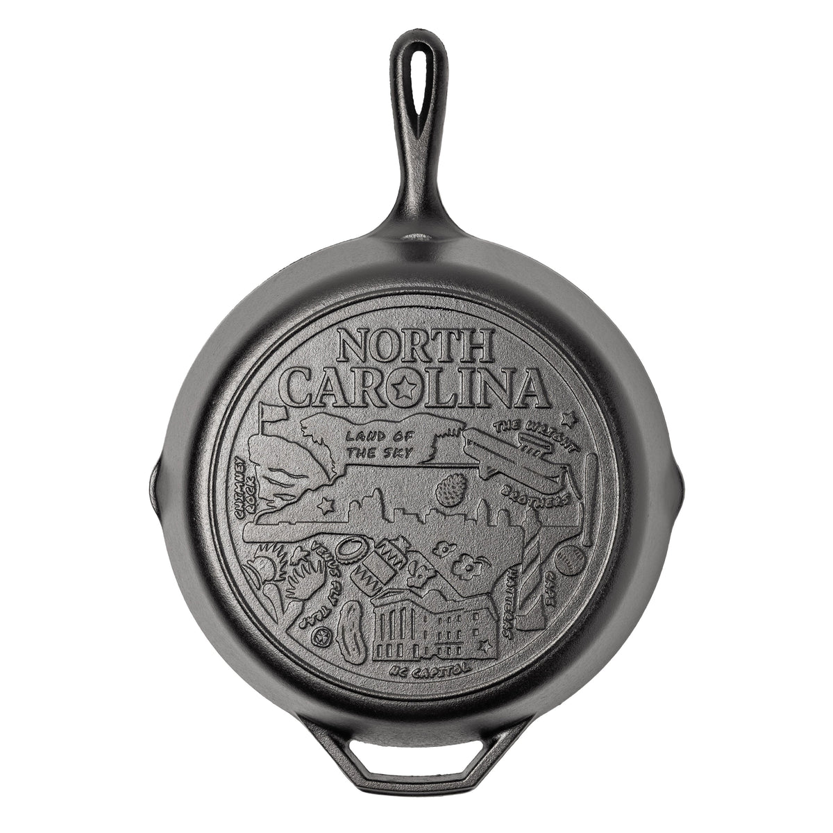 Cast iron skillet with the bottom engraved with beloved icons and monuments from North Carolina.