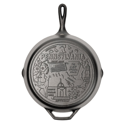 Cast iron skillet with the bottom engraved with beloved icons and monuments from Pennsylvania.