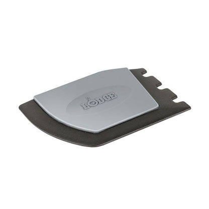Black and gray scraper with one smooth side for flat surfaces and one serrated side for grill pans.