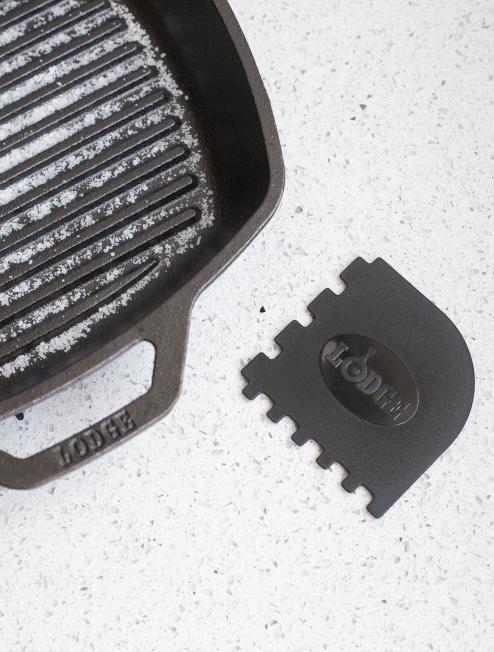 Scraper next to grill pan.