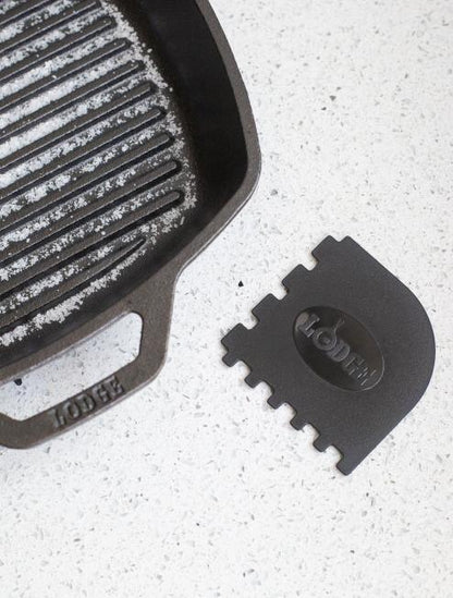 Scraper next to grill pan.