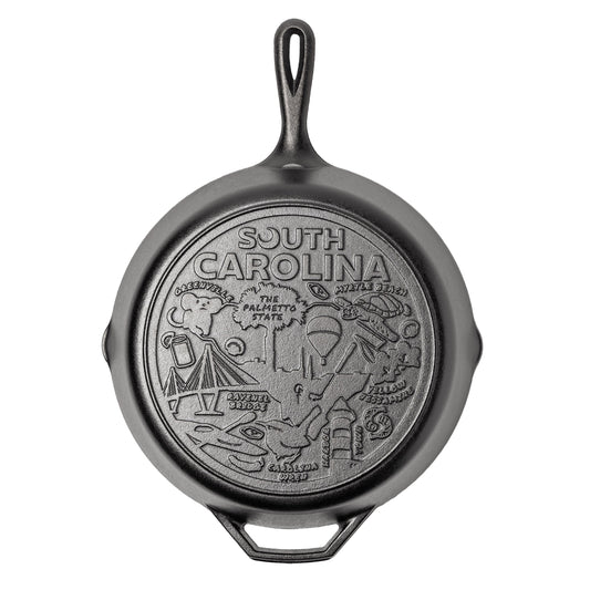 Cast iron skillet with the bottom engraved with beloved icons and monuments from South Carolina.