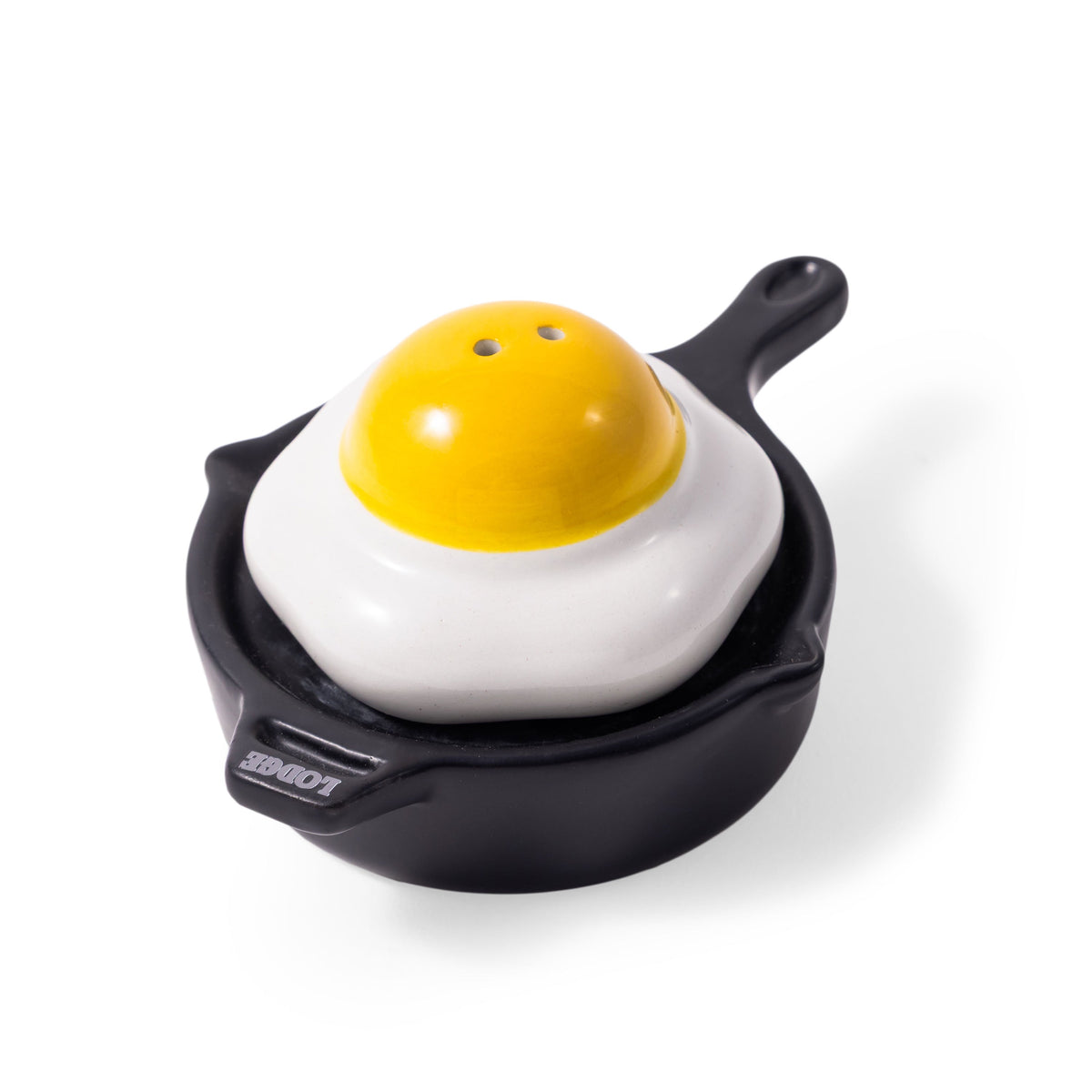 Salt and pepper shaker set shaped like a fried egg with a yellow yolk on a white background