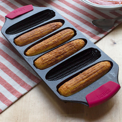 Bakeware grips on our Lodge Cornstick Pan with freshly baked cornbread.