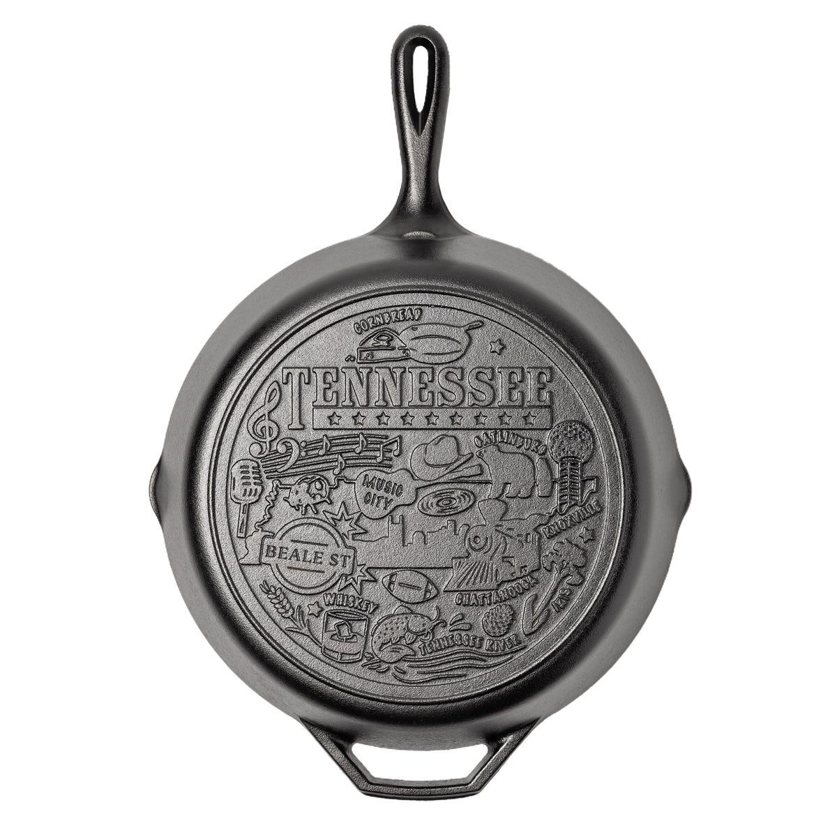 Black cast iron skillet with 'Tennessee' design on a white background