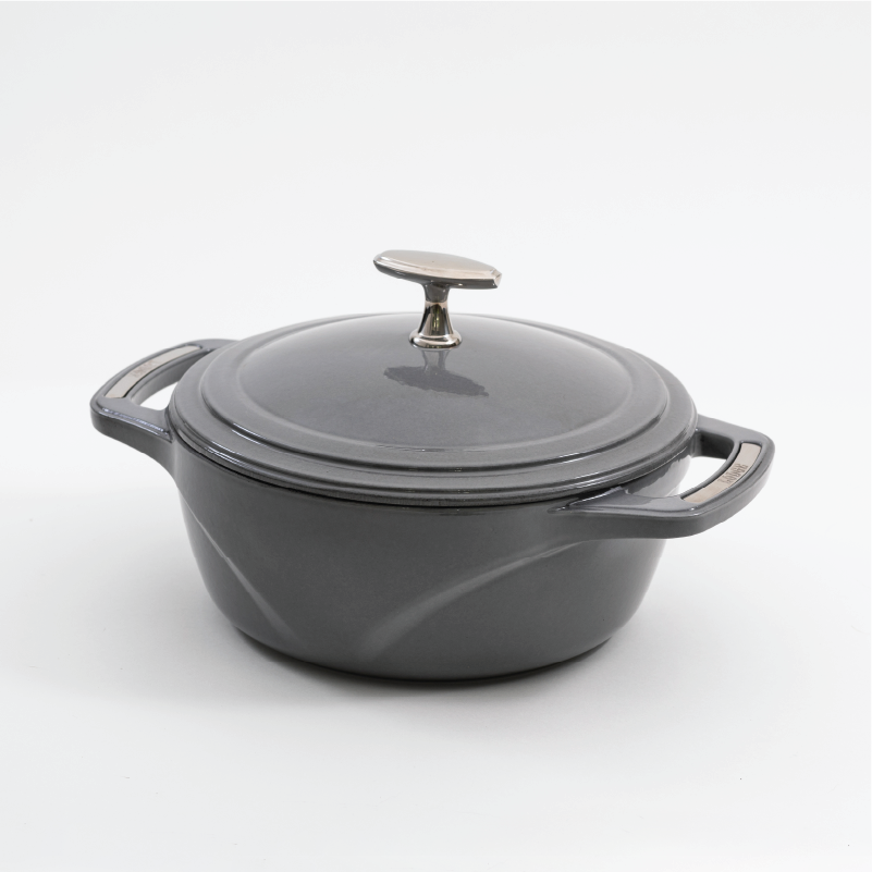 Grey enameled cast iron Dutch oven with a lid on a white background