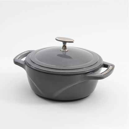 Grey enameled cast iron Dutch oven with a lid on a white background