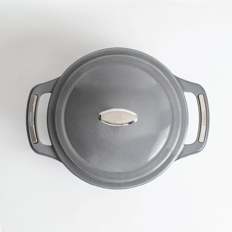 Top view of grey dutch oven featuring silver knob on lid and silver accents on handles.