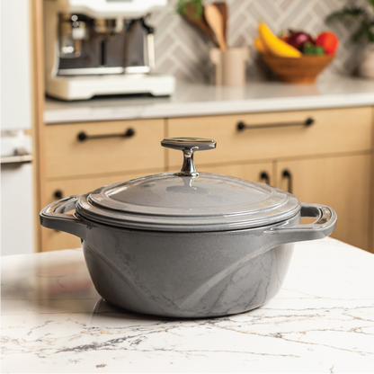 Grey dutch oven on kitchen counter top.