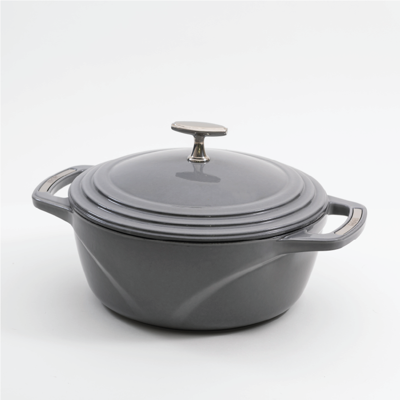 Grey enameled cast iron Dutch oven with a lid on a white background