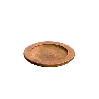 A circular wooden underliner with indent for skillet or other serving dish.