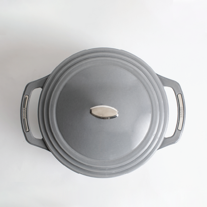 Top view of grey dutch oven featuring silver knob on lid and silver accents on handles.