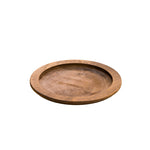A circular wooden underliner with indent for skillet or other serving dish.