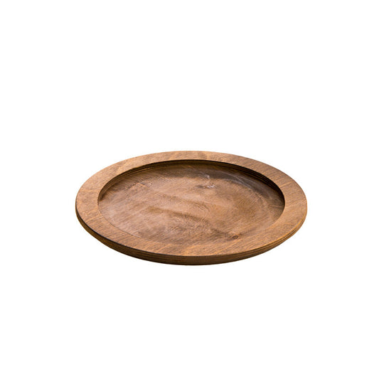 A circular wooden underliner with indent for skillet or other serving dish.
