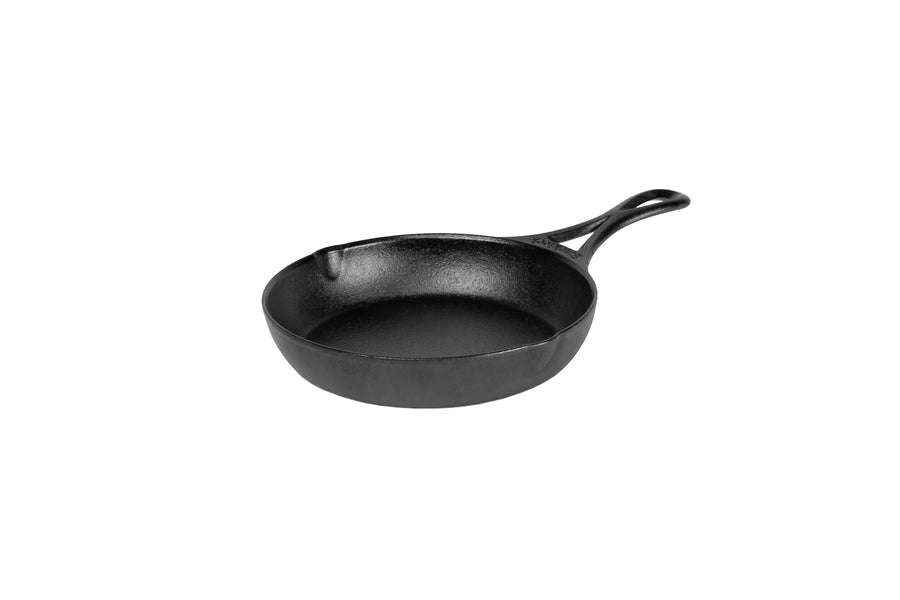 A black, cast iron skillet with a long handle and two pour spouts on opposite sides.