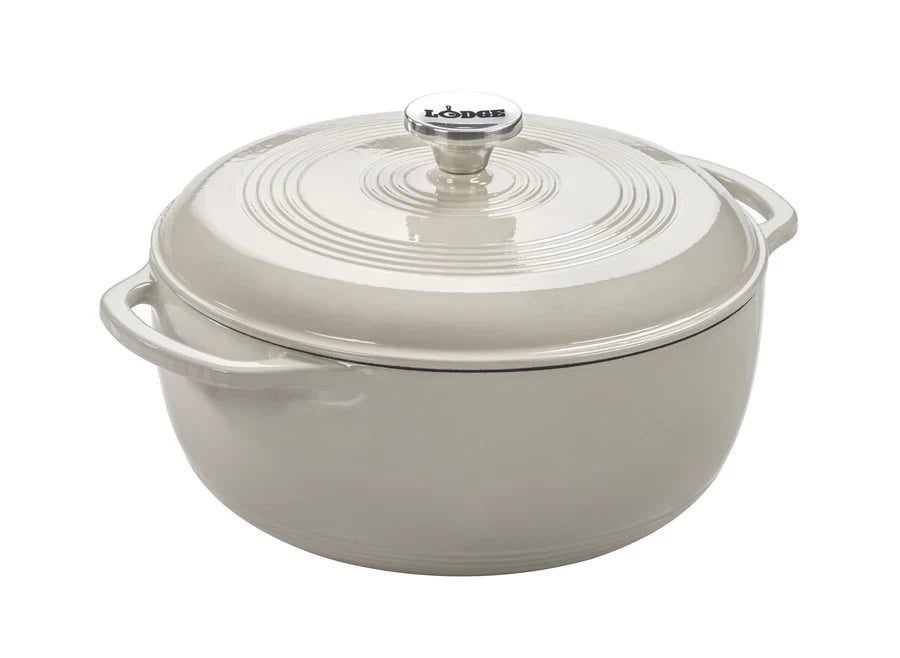 Oyster white enameled cast iron Dutch oven with lid on a white background