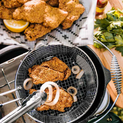 Someone serving fried food from basket.