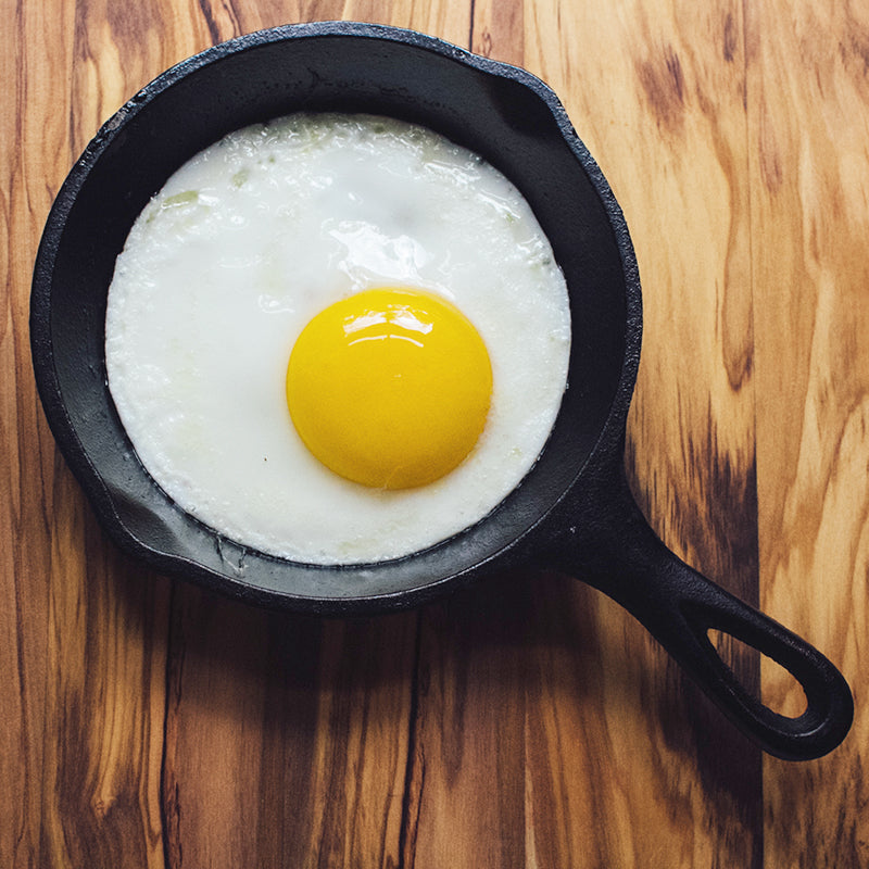 Sunny side egg fried in skillet.